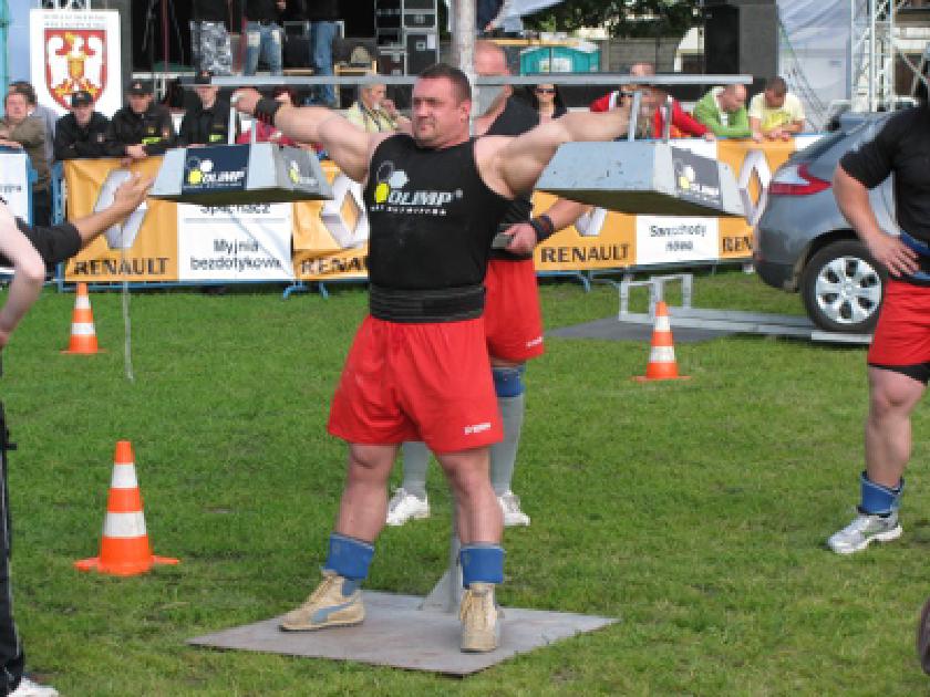 Strongman holding a crucifix